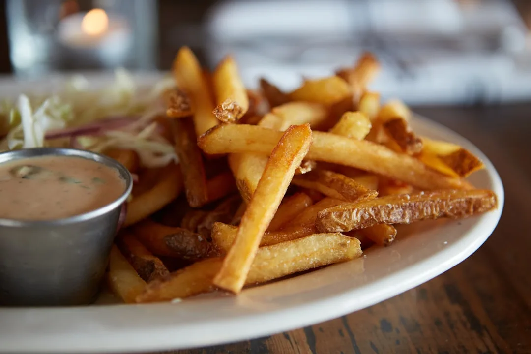 Bowl of pub chips with dipping sauce